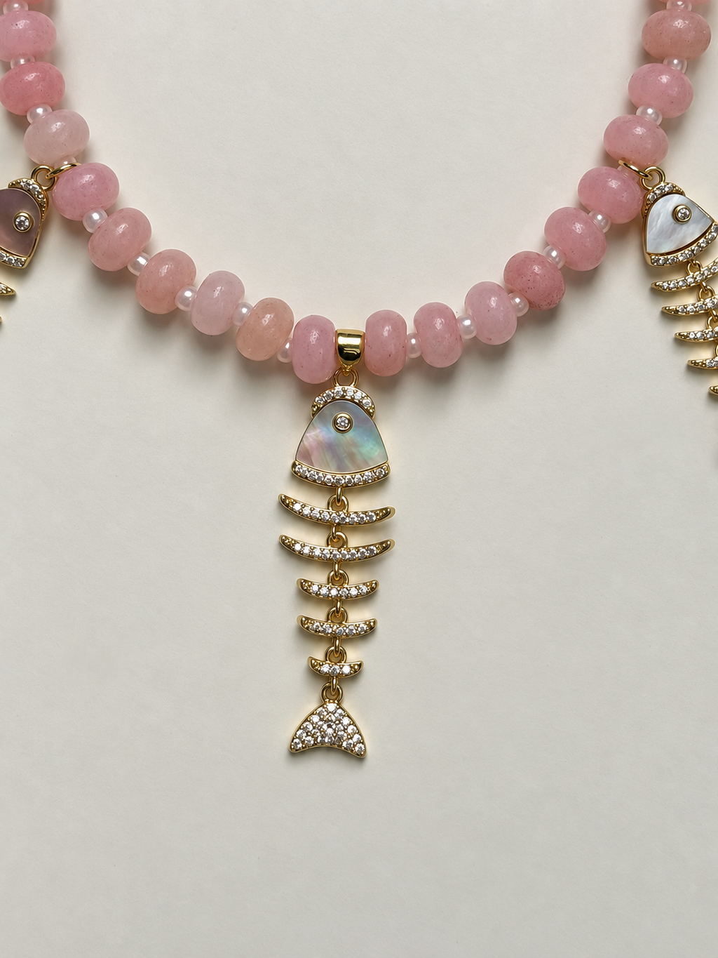 Studio Marea Isola Rosa Necklace – Pink Rondelle Bead & Fishbone Charm Necklace, Handmade