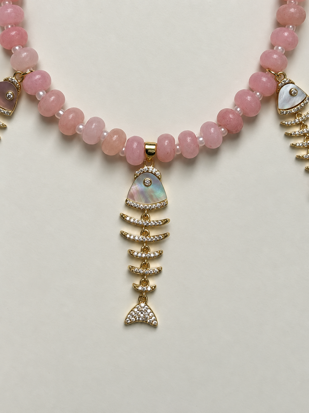 Studio Marea Isola Rosa Necklace – Pink Rondelle Bead & Fishbone Charm Necklace, Handmade