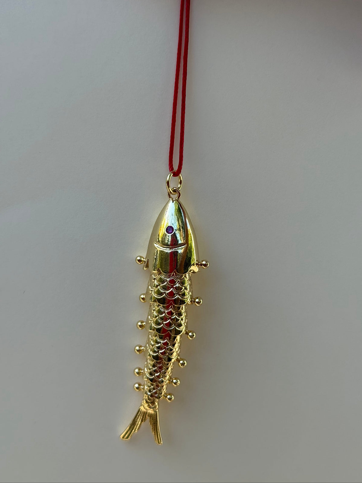 Studio Marea Bali Fish Necklace – Gold Articulated Fish Pendant on Red Cord, Handmade, Adjustable